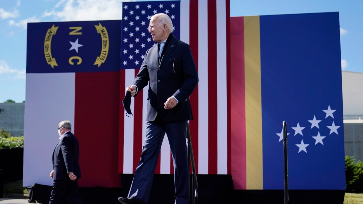 Democratic presidential candidate former Vice President Joe Biden arrives to speak during a campaign event at Riverside High School in Durham, N.C., Sunday, Oct. 18, 2020. (AP Photo/Carolyn Kaster)