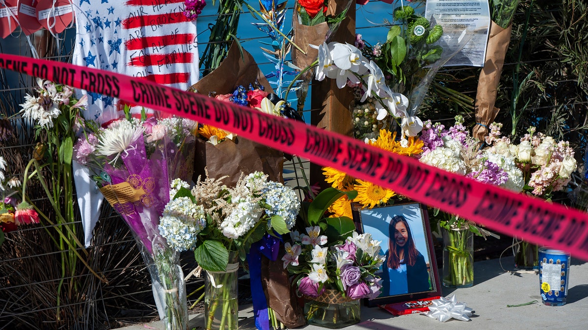 In this Sept. 8, 2019 file photo, red crime scene tape blocks off a memorial for the victims of the Conception dive boat fire on the Santa Barbara Harbor, as authorities issue a search warrant for the Truth Aquatics' offices on the Santa Barbara Harbor in Santa Barbara, Calif. (AP Photo/ Christian Monterrosa, File)