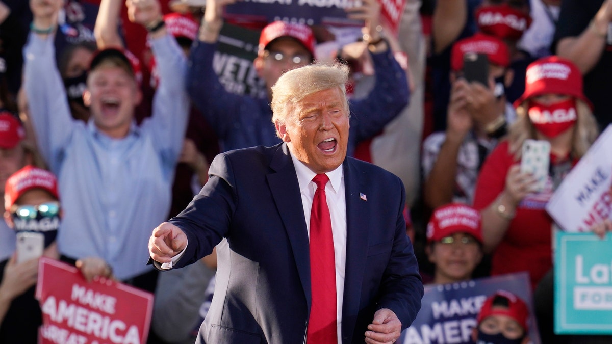 President Trump works the crowd after speaking at a campaign rally Monday, Oct. 19, 2020, in Tucson, Ariz. (AP Photo/Ross D. Franklin)
