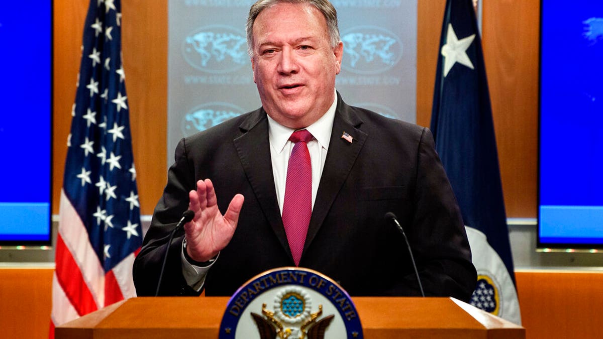 Secretary of State Mike Pompeo speaks during a news conference at the State Department in Washington, Wednesday, Oct. 21, 2020. (Nicholas Kamm/Pool via AP)