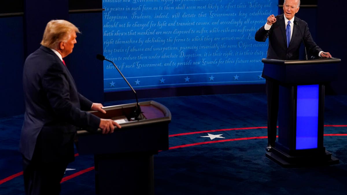 Democratic presidential candidate former Vice President Joe Biden points toward President Donald Trump during the second and final presidential debate Thursday, Oct. 22, 2020, at Belmont University in Nashville, Tenn. (AP Photo/Morry Gash, Pool)