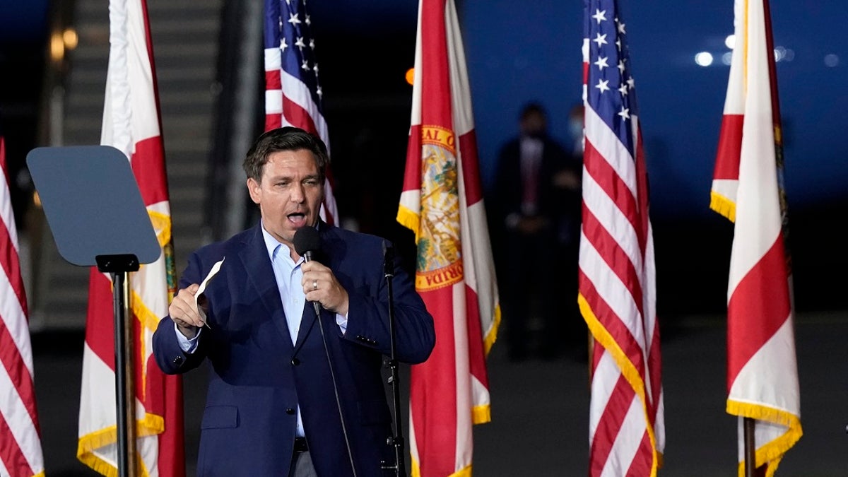 Florida Gov. Ron DeSantis speaks before President Donald Trump at a campaign rally in Pensacola, Fla., last week. His address was illegally changed and found out Monday when he tried to cast a ballot. (AP Photo/Gerald Herbert)