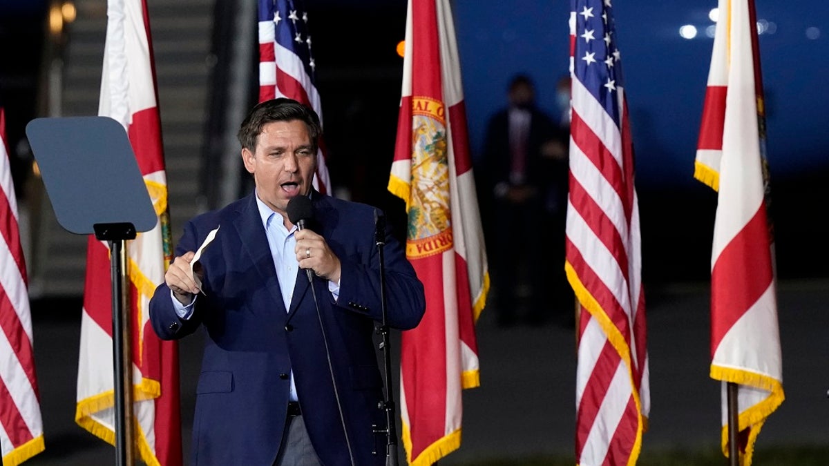 Florida Gov. Ron DeSantis speaks before President Donald Trump at a campaign rally in Pensacola, Fla., last week. His address was illegally changed and found out Monday when he tried to cast a ballot. (AP Photo/Gerald Herbert)