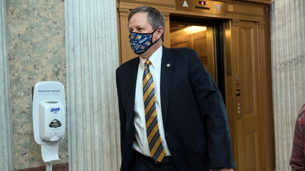 Sen. Steve Daines, R-Mont., arrives for votes during a rare weekend session to advance the confirmation of Judge Amy Coney Barrett to the Supreme Court, at the Capitol in Washington. (AP Photo/J. Scott Applewhite)