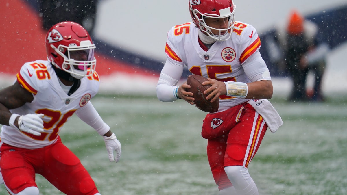 Kansas City Chiefs quarterback Patrick Mahomes, right, drops back alongside running back Le'Veon Bell during the first half of an NFL football game against the Denver Broncos, Sunday, Oct. 25, 2020, in Denver. (AP Photo/Jack Dempsey)