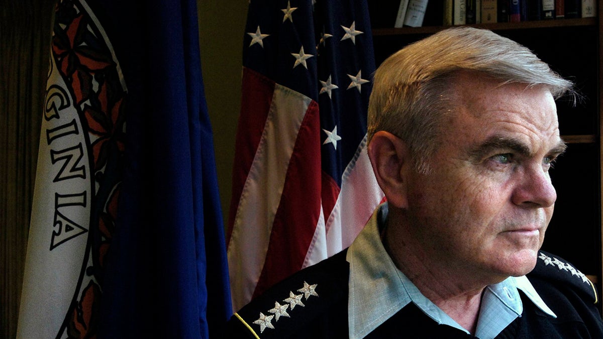 Army Gen. J.H. Binford Peay III, superintendent of the Virginia Military Institute, looks out the window of his office in Lexington, Va., in this April 26, 2007, photo. He has since resigned, the school's board president announced in a statement Monday, Oct. 26, 2020. (Bob Brown/Richmond Times-Dispatch via AP)