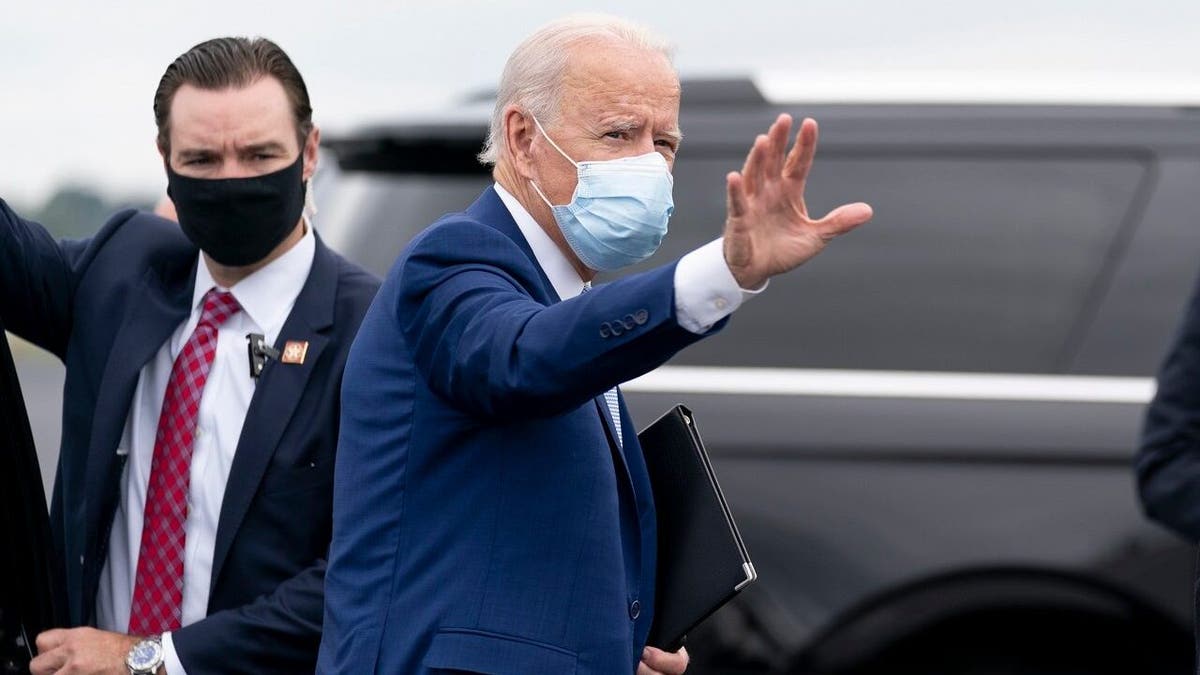 Democratic presidential candidate former Vice President Joe Biden boards his campaign plane at Columbus Airport in Columbus, Ga., Tuesday, Oct. 27, 2020, to travel to Atlanta for a rally. (AP Photo/Andrew Harnik)