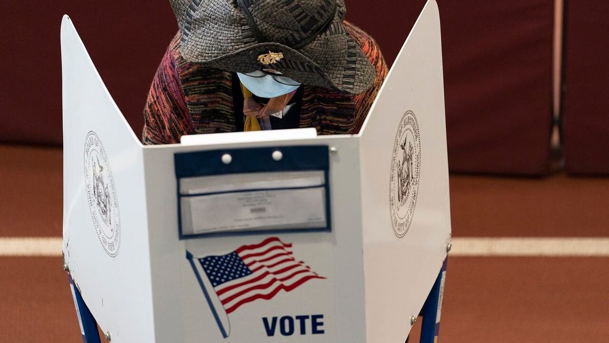 A voter marks her ballot during early voting at the Park Slope Armory YMCA, Tuesday, Oct. 27, 2020, in the Brooklyn borough of New York. (AP Photo/Mary Altaffer)