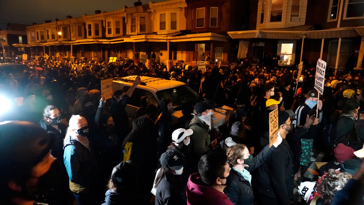 Protesters confront police during a march Oct. 27, in Philadelphia. (AP Photo/Matt Slocum)