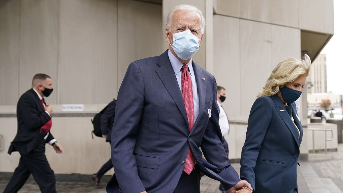 Democratic presidential candidate former Vice President Joe Biden and his wife Jill Biden leave after they voted at the Carvel State Office Building, Wednesday, Oct. 28, 2020, in Wilmington, Del. (AP Photo/Andrew Harnik)
