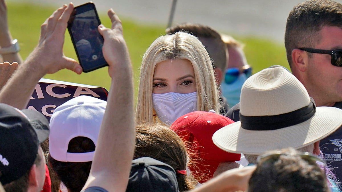 Ivanka Trump, daughter and adviser to President Donald Trump, wears a protective mask as she greets supporters along a rope line after a campaign event Tuesday, Oct. 27, 2020, in Sarasota, Fla. (AP Photo/Chris O'Meara)