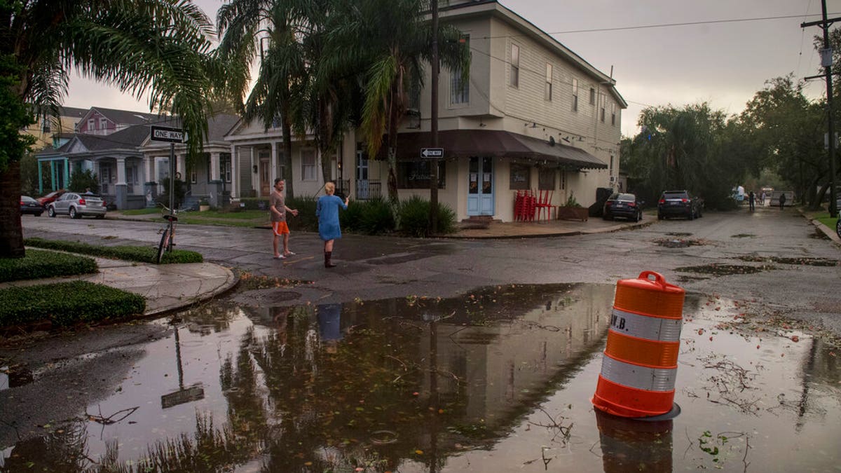 Residents come out to assess the damage from Hurricane Zeta on Oct. 28, near the restaurant Patois in New Orleans. (Chris Granger/The Times-Picayune/The New Orleans Advocate via AP)