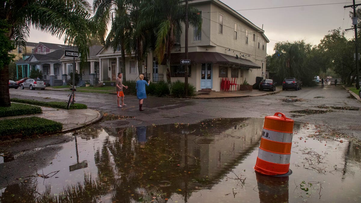 Residents come out to assess the damage from Hurricane Zeta on Oct. 28, near the restaurant Patois in New Orleans. (Chris Granger/The Times-Picayune/The New Orleans Advocate via AP)