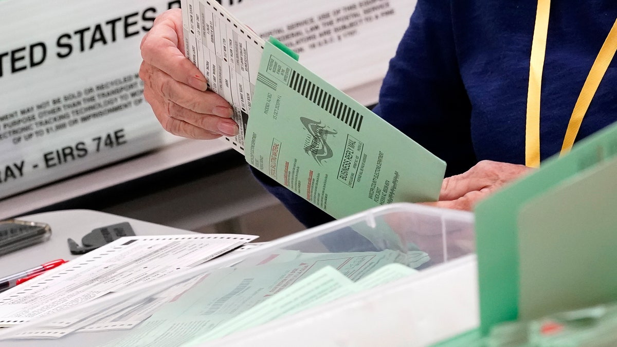 Election workers sort ballots Oct. 21 at the Maricopa County Recorder's Office in Phoenix. (Associated Press)