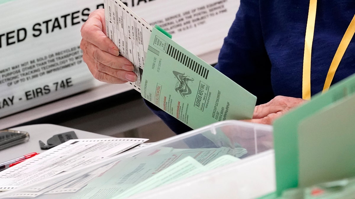 Election workers sort ballots Oct. 21 at the Maricopa County Recorder's Office in Phoenix. (Associated Press)