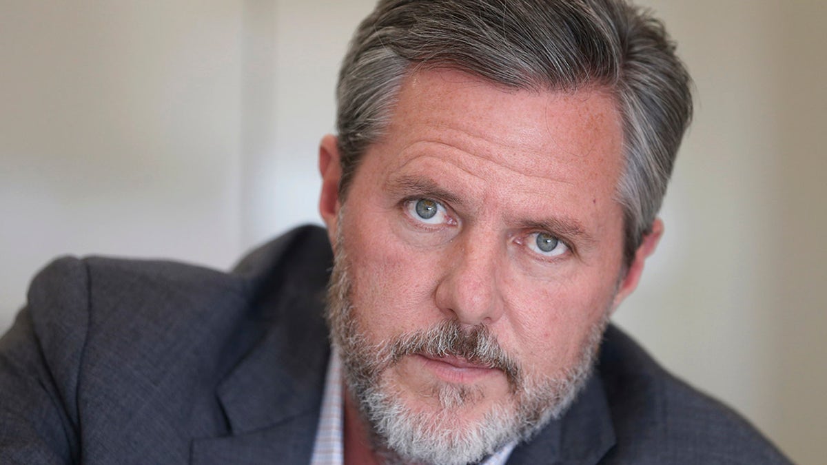 FILE - In this Nov. 16, 2016 file photo, Liberty University president Jerry Falwell Jr., poses during an interview in his offices at the school in Lynchburg, Va. Falwell filed a lawsuit Wednesday, Oct. 28, 2020, against Liberty University with defamation and breach of contract claims alleging the school damaged his reputation in statements after his resignation. (AP Photo/Steve Helber, File)