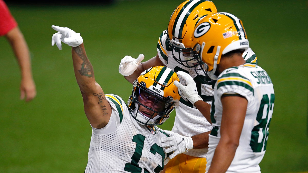 Green Bay Packers wide receiver Allen Lazard (13) reacts after a 72 year pass completion setting up a touchdown in the second half of an NFL football game against the New Orleans Saints in New Orleans, Sunday, Sept. 27, 2020. (AP Photo/Butch Dill)