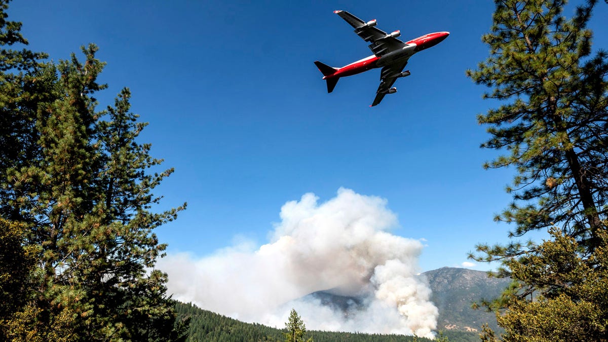 In this Sept. 17, 2020, file photo, an air tanker prepares to drop retardant while battling the August Complex Fire in the Mendocino National Forest, Calif.