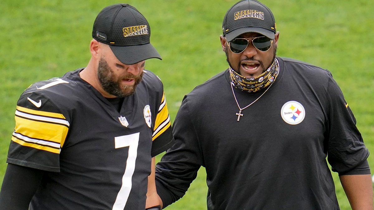 Pittsburgh Steelers quarterback Ben Roethlisberger (7) walks off the field with head coach Mike Tomlin after an NFL football game against the Houston Texans, Sunday, Sept. 27, 2020, in Pittsburgh. (AP Photo/Gene J. Puskar)