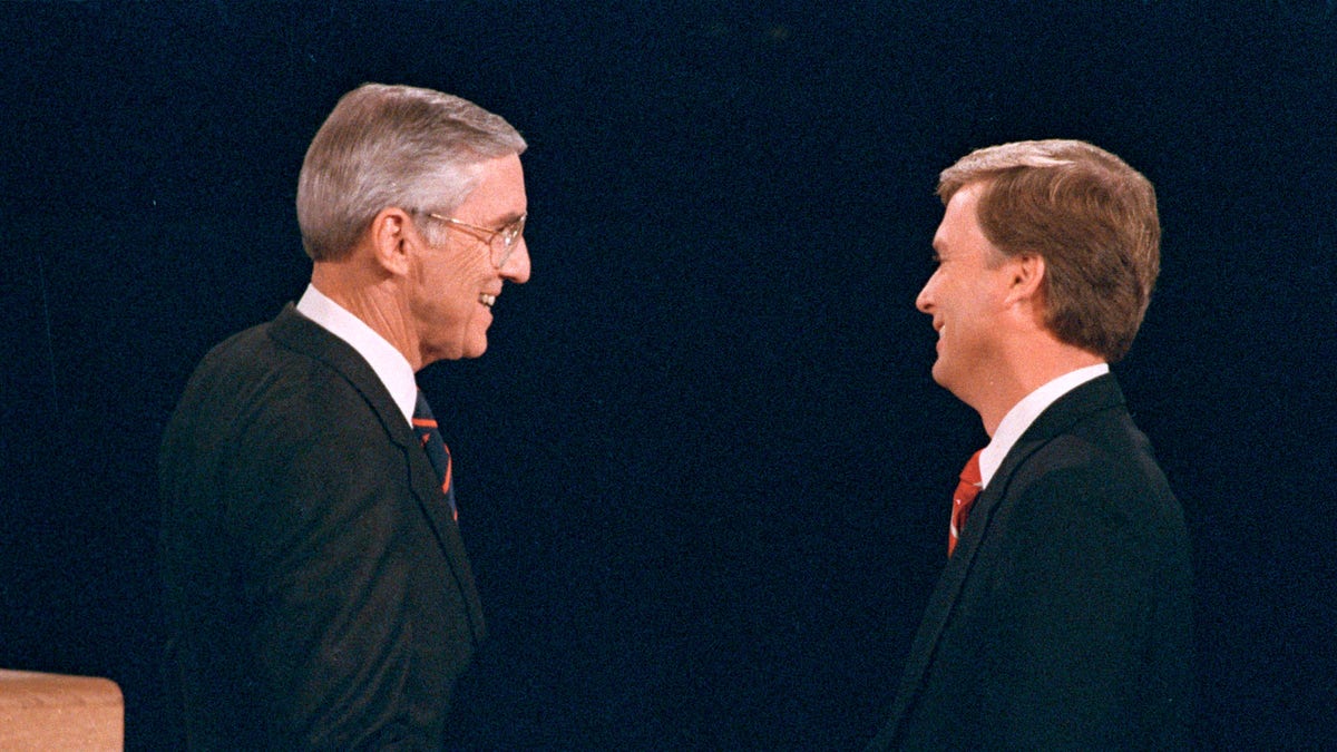 FILE - In this Oct. 5, 1988, file photo, Sen. Lloyd Bentsen, D-Texas, left, shakes hands with Sen. Dan Quayle, R-Ind., before the start of their vice presidential debate at the Omaha Civic Auditorium, Omaha, Neb.  (AP Photo/Ron Edmonds)