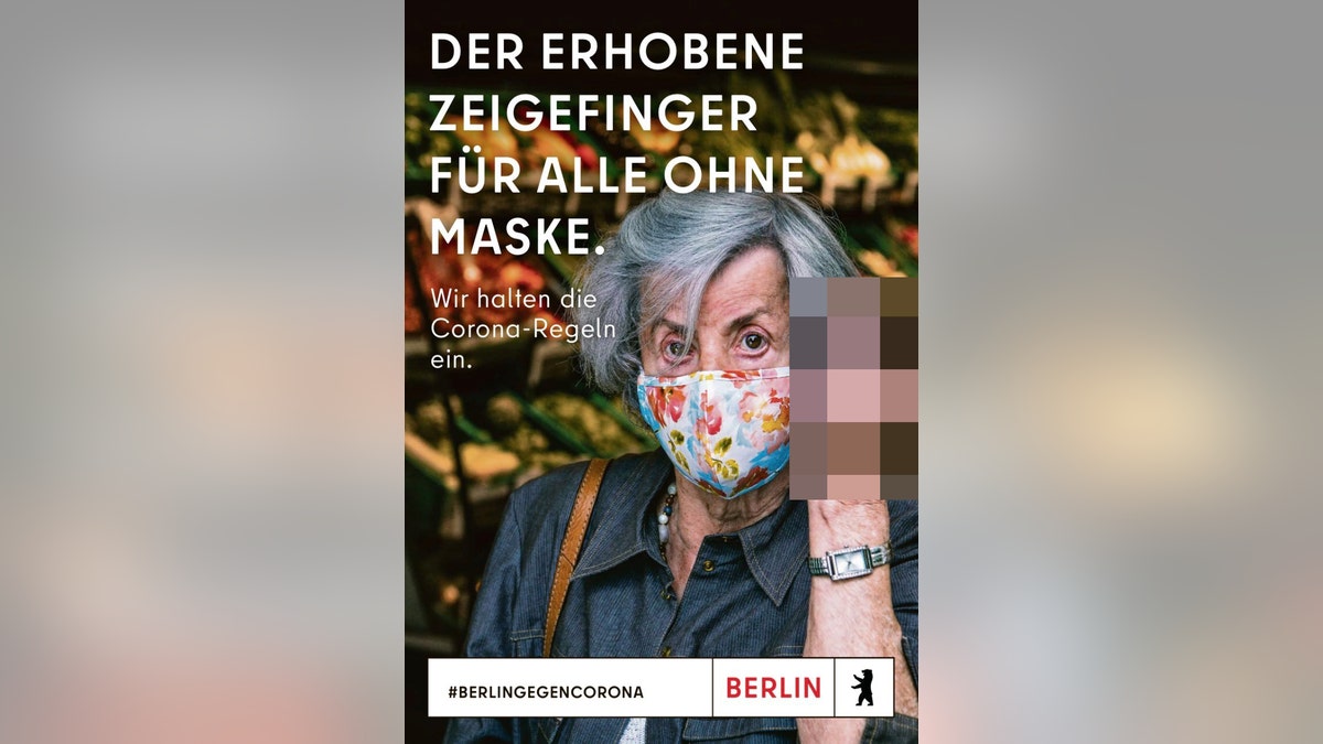 The ad featured an image of a woman brandishing her finger at "those without a mask."