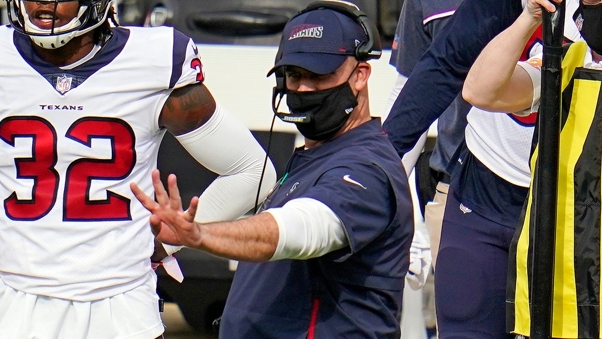 Houston Texans head coach Bill O'Brien, center, gives signals from the sideline during the second half of an NFL football game against the Pittsburgh Steelers in Pittsburgh, Sunday, Sept. 27, 2020. (AP Photo/Gene J. Puskar)