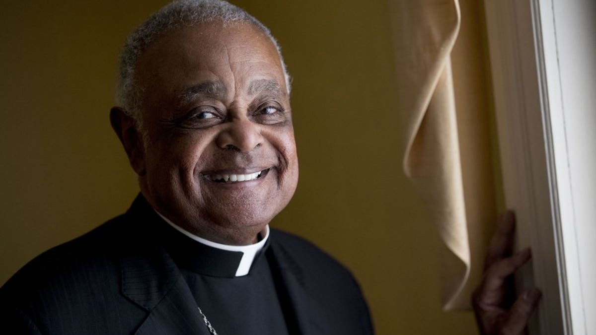 FILE - This Sunday, June 2, 2019, file photo shows Washington D.C. Archbishop Wilton Gregory posed for a portrait following mass at St. Augustine Church in Washington. Pope Francis has named 13 new cardinals, including Washington D.C. Archbishop Wilton Gregory, who would become the first Black U.S. prelate to earn the coveted red cap. In a surprise announcement from his studio window to faithful standing below in St. Peter’s Square, Sunday, Oct. 25, 2020, Francis said the churchmen would be elevated to a cardinal’s rank in a ceremony on Nov. 28. (AP Photo/Andrew Harnik, File)