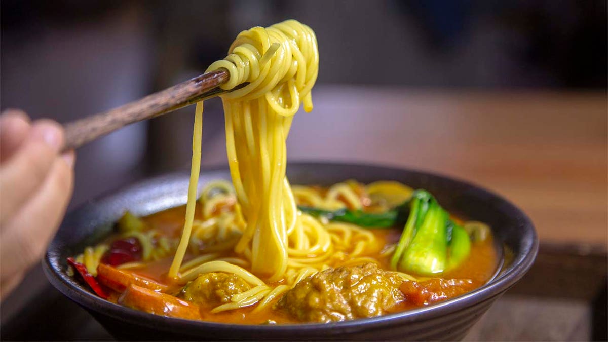 Eating long noodles during Chinese Lunar New Year is a tradition that's done to symbolize a long life.