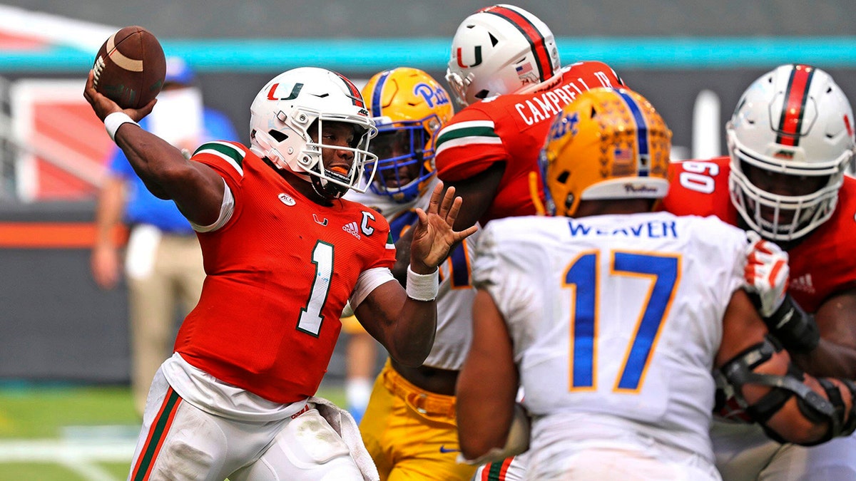 Miami quarterback D'Eriq King (1) passes against Pitt in the second half of an NCAA college football game in Miami Gardens, Fla., Saturday, Oct. 17, 2020. (Al Diaz/Miami Herald via AP)