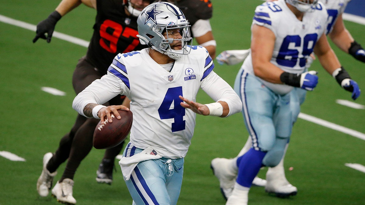 Dallas Cowboys quarterback Dak Prescott (4) scrambles out of the pocket before throwing a pass in the second half of an NFL football game against the Cleveland Browns in Arlington, Texas, Sunday, Oct. 4, 2020. (AP Photo/Michael Ainsworth)