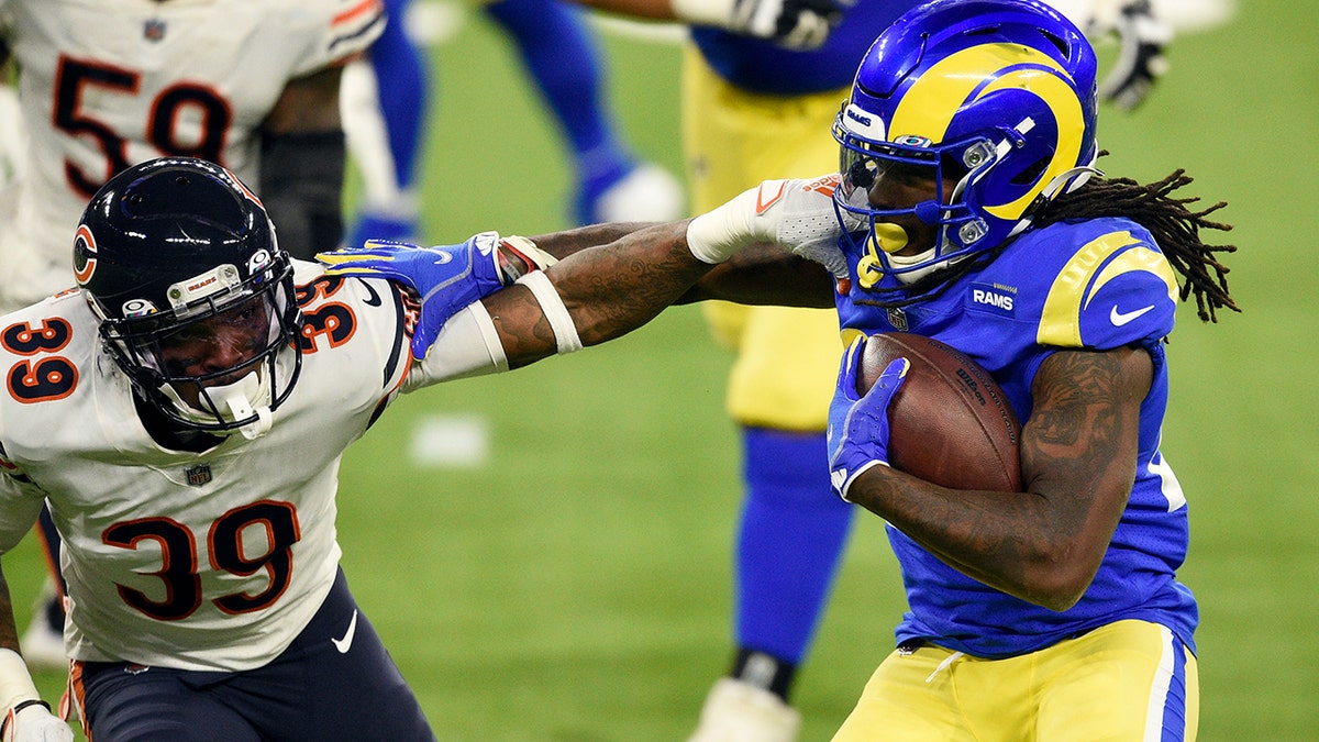 Los Angeles Rams running back Darrell Henderson, right, tries to get around Chicago Bears defensive back Eddie Jackson (39) during the second half of an NFL football game Monday, Oct. 26, 2020, in Inglewood, Calif. (AP Photo/Kelvin Kuo)