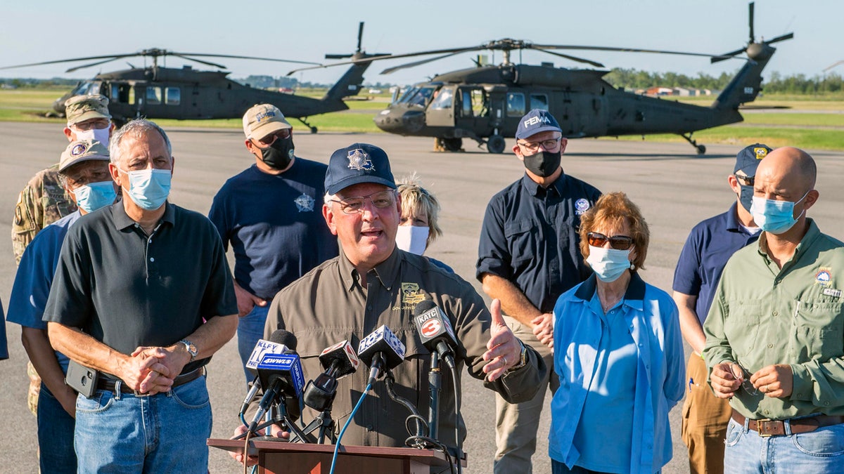 Louisiana Gov. John Bel Edwards talks about the devastation from Hurricane Delta after flying over the stricken areas in southwest Louisiana during a press conference at the airport Saturday Oct. 10, 2020, in Jennings, La.