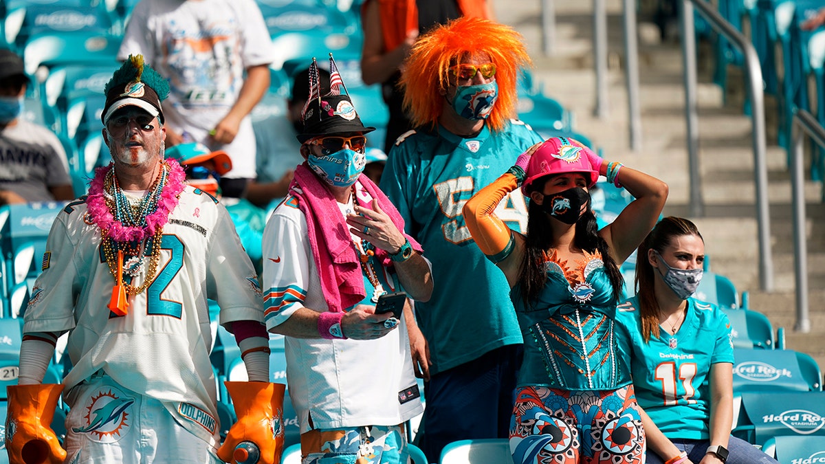 Miami Dolphins fans react as the team falls further behind during the second half of an NFL football game against the Seattle Seahawks, Sunday, Oct. 4, 2020 in Miami Gardens, Fla. The Seahawks defeated the Dolphins 31-23.(AP Photo/Wilfredo Lee)