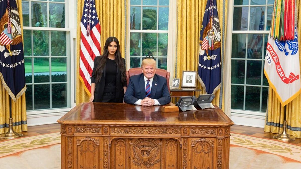 Kim Kardashian said she was warned that working with President Donald Trump could damage her reputation.