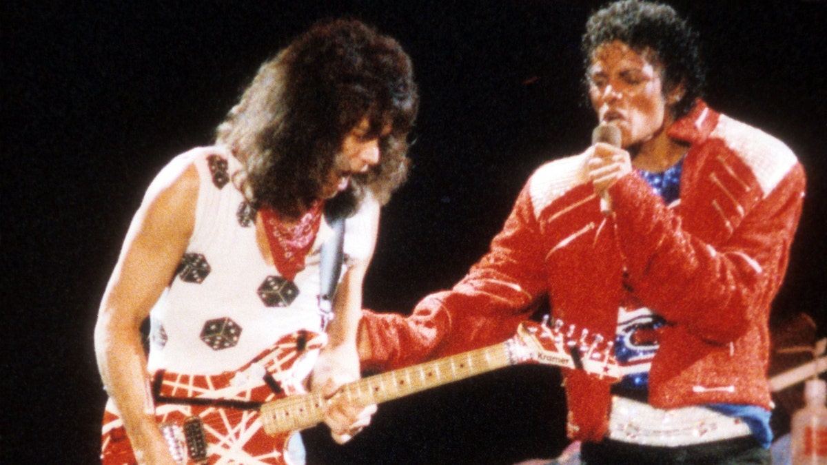 Guitarist Eddie Van Halen joins pop star Michael Jackson on stage to perform his hit song "Beat It" during The Jacksons Victory Tour on July 14, 1984 at Texas Stadium in Dallas. (Getty Images)