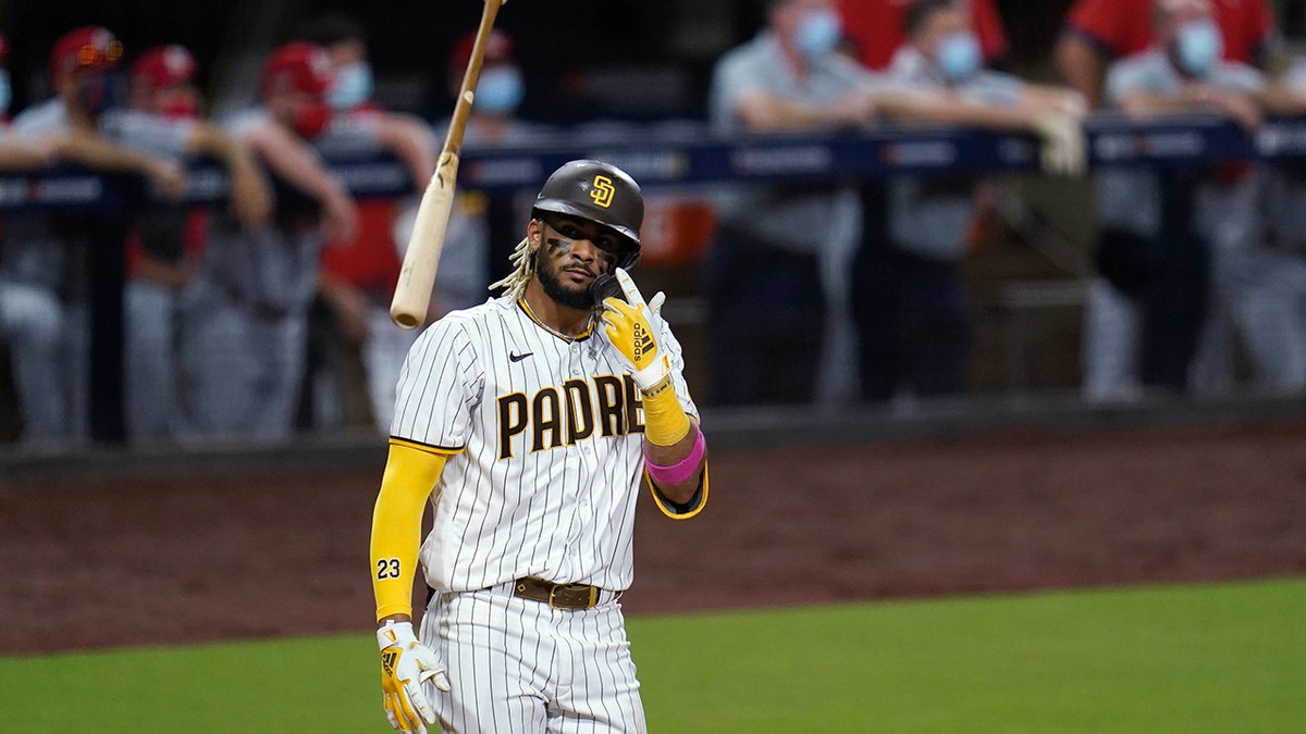 San Diego Padres' Fernando Tatis Jr. tosses his bat after hitting a two-run home run during the seventh inning of Game 2 of the team's National League wild-card baseball series against the St. Louis Cardinals, Thursday, Oct. 1, 2020, in San Diego. (AP Photo/Gregory Bull)