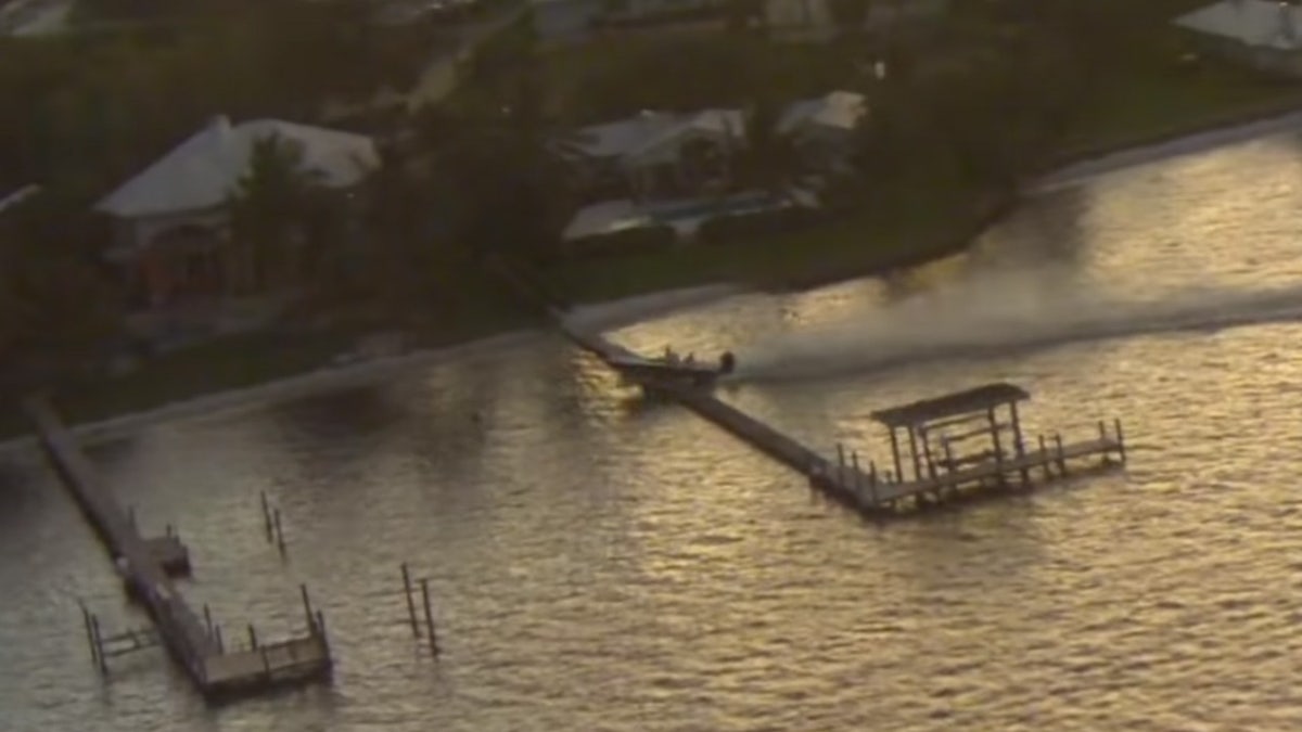 The out-of-control boat made a crash landing after going airborne over a dock in Stuart, Fla. on Friday.