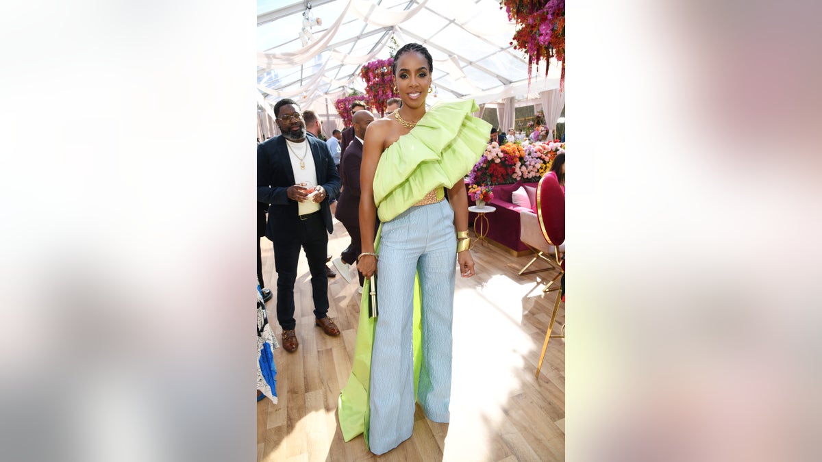 Kelly Rowland says she was hesitant to announce pregnancy amid a tough year for herself and fans across the U.S.