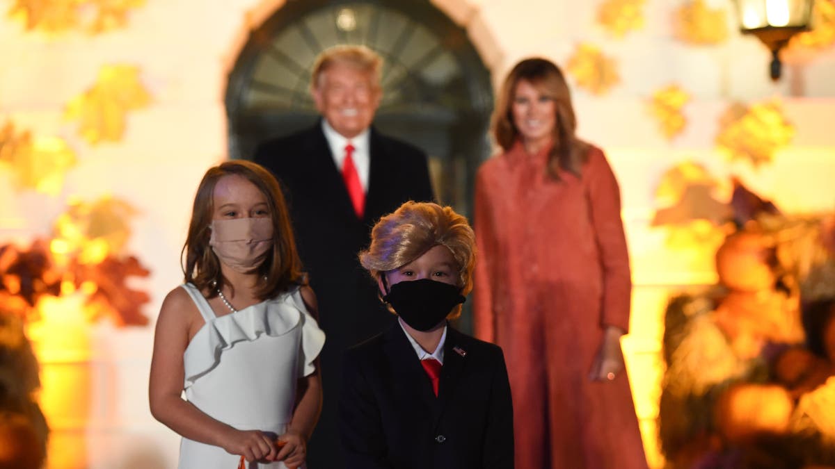 The president is said to have been “particularly pleased” with two youngsters dressed as the first couple, pictured. (Olivier Douliery/AFP via Getty Images)