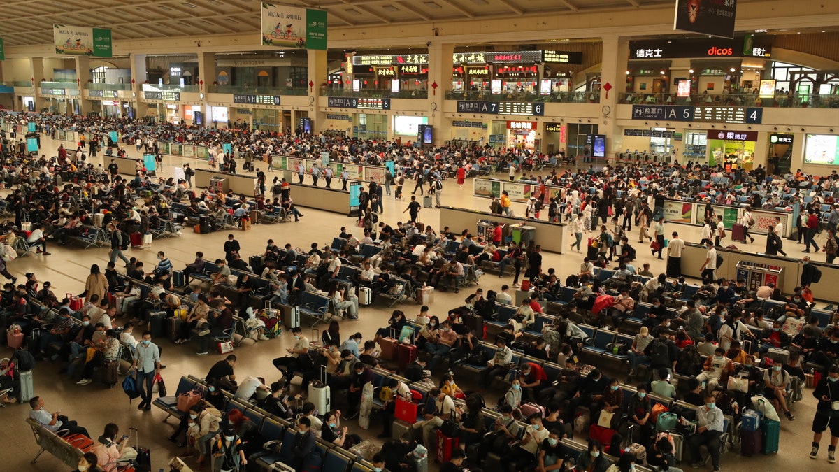 Passengers wait for their trains at Hankou Railway Station one day before the eight-day National Day holiday on September 30 in Wuhan, Hubei Province of China. (Hu Jinli/VCG via Getty Images)