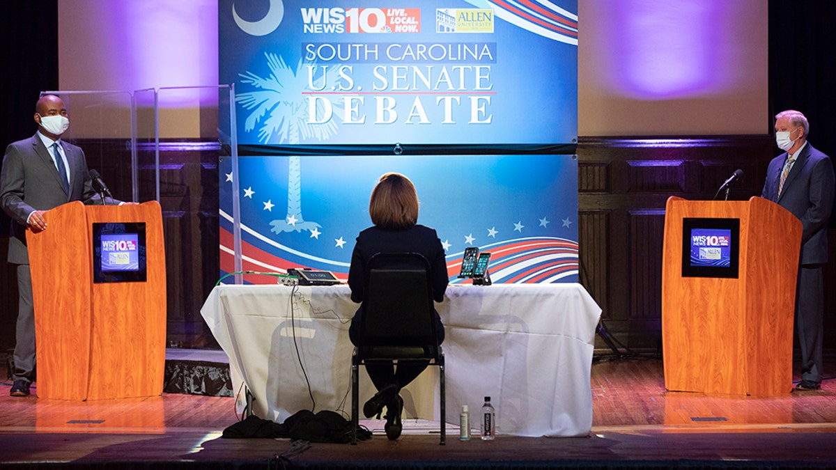 Democratic challenger Jaime Harrison, left, and U.S. Sen. Lindsey Graham, right, R-S.C., face off in the South Carolina U.S. Senate debate at Allen University in Columbia, S.C., Saturday, Oct. 3, 2020. (Associated Press)