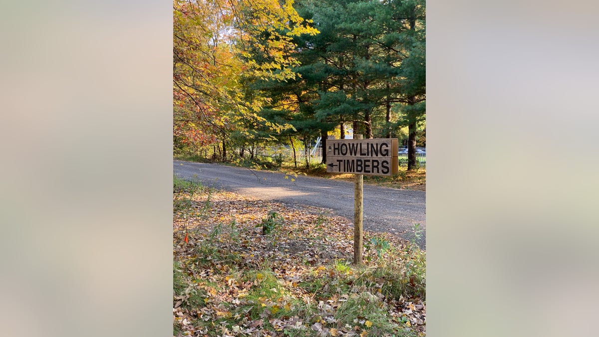 A sign showing the way to Howling Timbers, an animal sanctuary in Muskegon where the Michigan DNR served a search warrant Friday morning. (Courtesy: Michigan Department of Natural Resources)