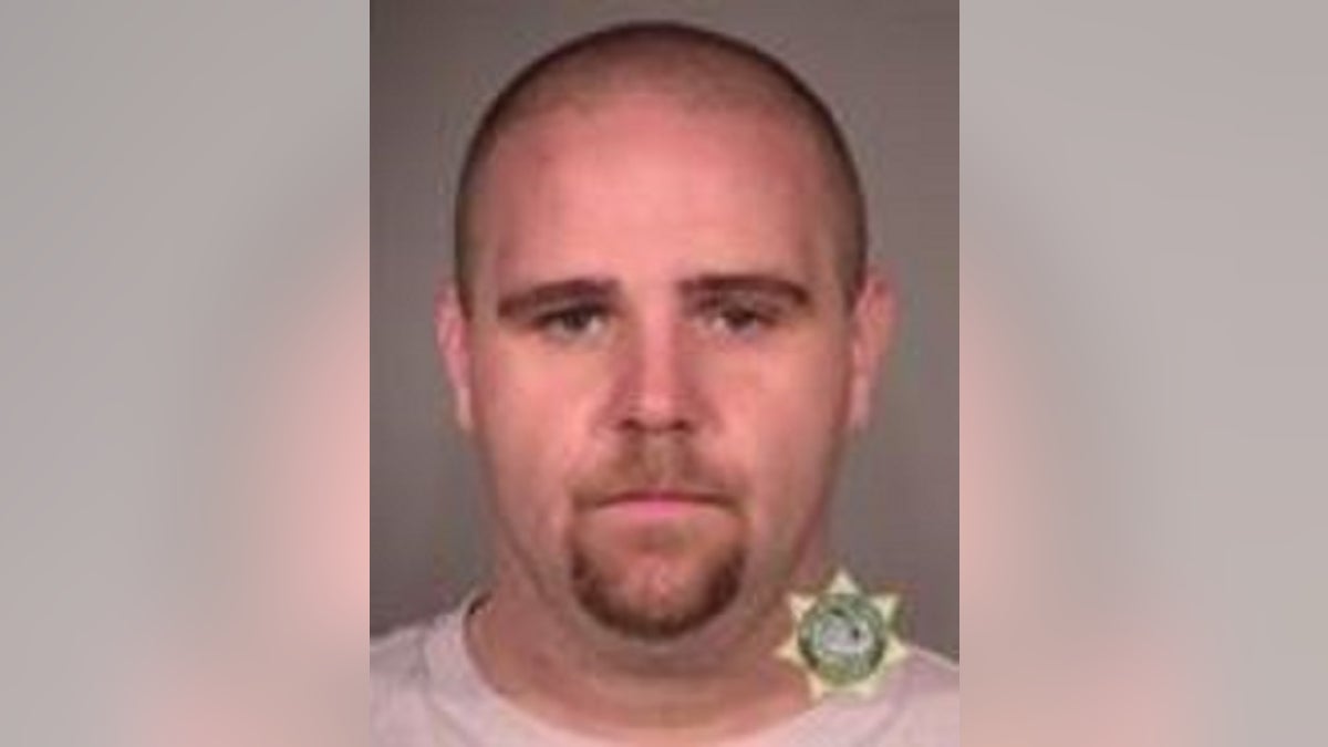 Jeffrey Richard Singer, 33, faces federal charges in connection with the alleged theft of an American flag and injury to a police officer during protests in Portland. 