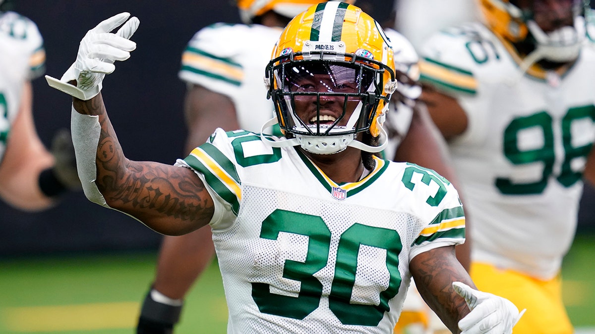 Green Bay Packers running back Jamaal Williams (30) warms up before an NFL football game against the Houston Texans, Sunday, Oct. 25, 2020, in Houston. (AP Photo/Sam Craft)