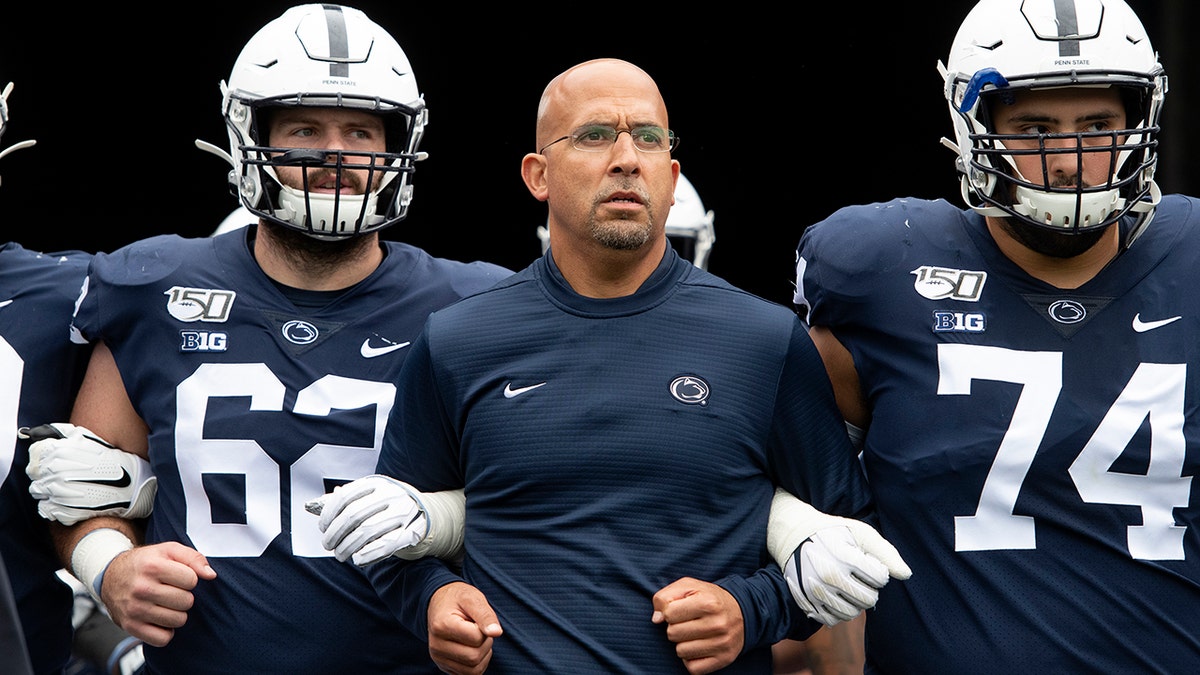 In this Saturday, Sept. 14, 2019 file photo, Penn State head coach James Franklin leads his team onto the field for an NCAA college football game against Pittsburgh in State College, Pa. The Indiana Hoosiers took some big steps in rebranding their football program last season. Now they're looking to build on the momentum. Penn State coach James Franklin and others around the league have watched Indiana's steady progression. They believe a cadre of offensive playmakers coupled with an experienced defense could put Indiana on the cusp of a breakthrough. (AP Photo/Barry Reeger, File)