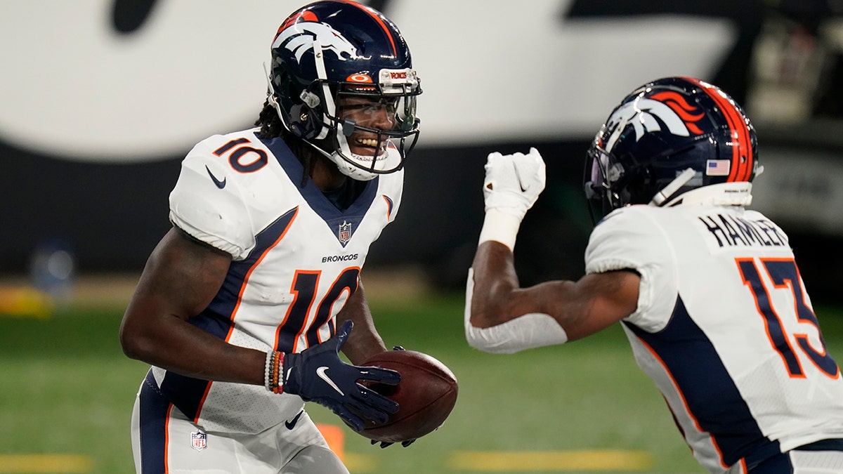 Denver Broncos wide receiver Jerry Jeudy (10) celebrates with K.J. Hamler (13) after scoring a touchdown during the first half of the team's NFL football game against the New York Jets on Thursday, Oct. 1, 2020, in East Rutherford, N.J. (AP Photo/Seth Wenig)