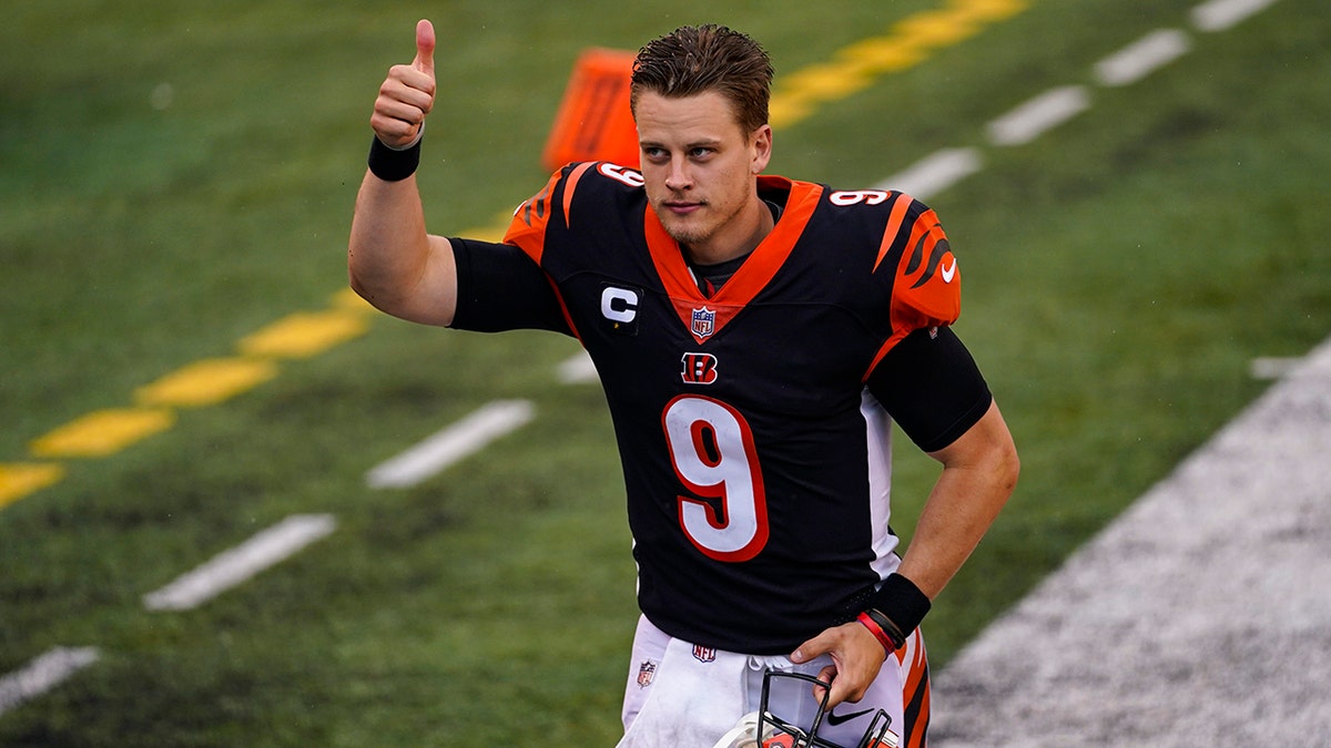 Cincinnati Bengals quarterback Joe Burrow (9) runs off the field following a 33-25 win over the Jacksonville Jaguars in an NFL football game in Cincinnati, Sunday, Oct. 4, 2020. (AP Photo/Bryan Woolston)