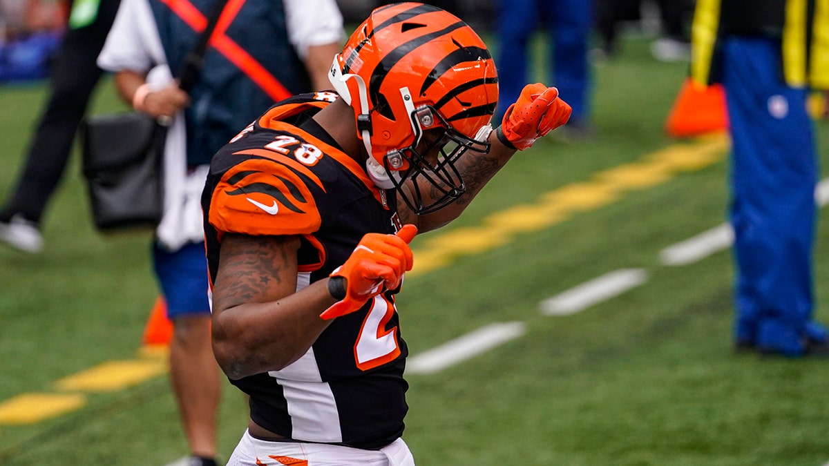 Cincinnati Bengals running back Joe Mixon (28) celebrates a touchdown against the Jacksonville Jaguars in the first half of an NFL football game in Cincinnati, Sunday, Oct. 4, 2020. (AP Photo/Bryan Woolston)