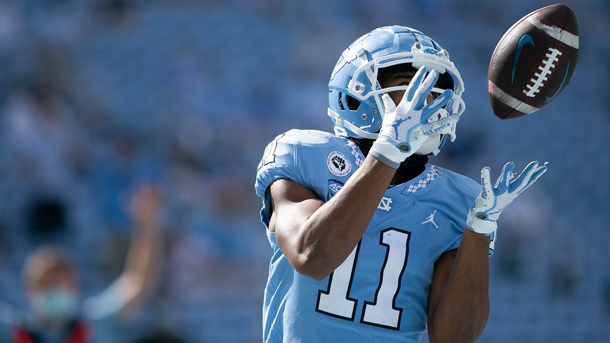 North Carolina's Josh Downs scores on a 17-yard pass from quarterback Sam Howell in the third quarter of an NCAA college football game against North Carolina State, Saturday, Oct. 24, 2020, in Chapel Hill, N.C. (Robert Willett/The News &amp; Observer via AP)