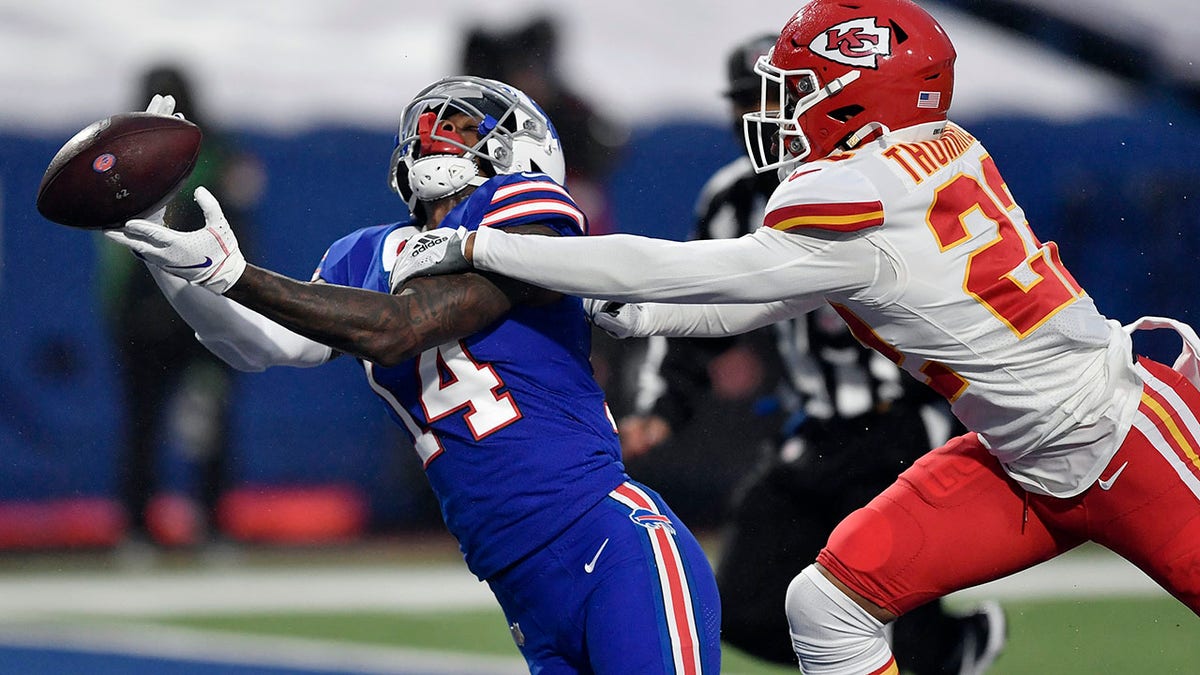 Kansas City Chiefs' Juan Thornhill, right, breaks up a pass intended for Buffalo Bills' Stefon Diggs during the first half of an NFL football game, Monday, Oct. 19, 2020, in Orchard Park, N.Y. (AP Photo/Adrian Kraus)